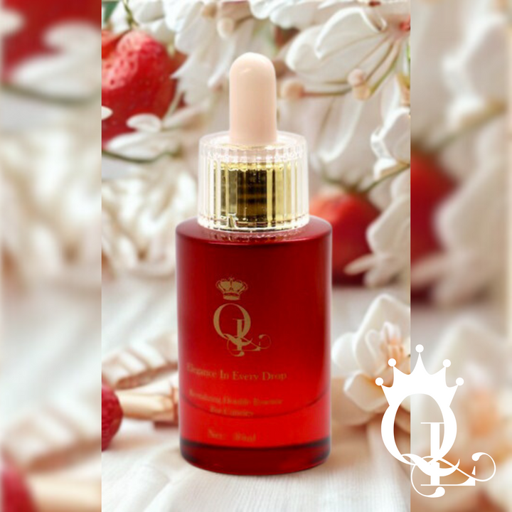 Red glass dropper bottle of cuticle oil, with a gold cap on a strawberry vanilla background